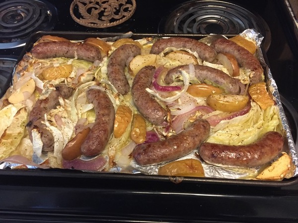 Bratwurst and Apples over Cabbage and Purple Onions